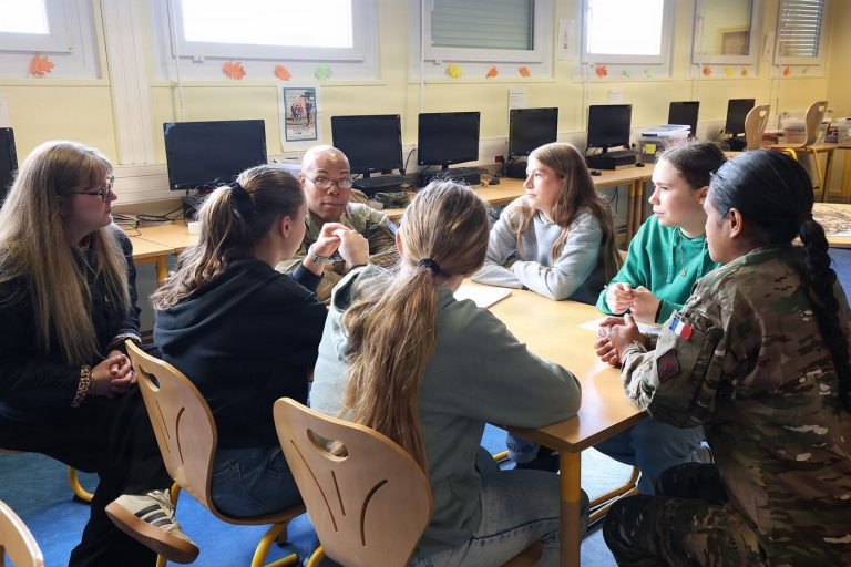 students asking questions in a classroom